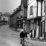 Tommy rides along the High Street, Aylesford, Kent